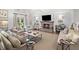 Bright living room featuring a fireplace, neutral tones, and cozy seating arrangements at 4643 River Ct, Peachtree Corners, GA 30097