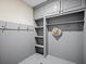 Gray mudroom features beadboard, coat hooks, shelves, and plenty of storage at 4643 River Ct, Peachtree Corners, GA 30097