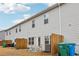 Townhome's back patio with seating area enclosed by a wooden fence at 5575 Rock Place Ct, Norcross, GA 30093