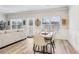 Bright dining room featuring a table with six chairs next to the living room at 5575 Rock Place Ct, Norcross, GA 30093