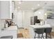 Modern kitchen featuring white cabinets, stainless steel appliances, and pendant lighting at 5575 Rock Place Ct, Norcross, GA 30093