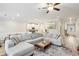 Spacious living area featuring a large sectional sofa, a coffee table, and hardwood floors at 5575 Rock Place Ct, Norcross, GA 30093