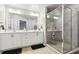 Elegant primary bathroom boasting double vanity sinks and a spacious glass enclosed shower at 5575 Rock Place Ct, Norcross, GA 30093