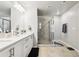 Primary bathroom highlighting a dual sink vanity with a large, glass-enclosed shower at 5575 Rock Place Ct, Norcross, GA 30093