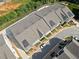 Aerial view of townhomes showcasing the landscaped community at 677 Stickley Oak Way, Woodstock, GA 30189