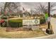 A serene park with a manicured lawn, walking paths, and memorial landmarks at 677 Stickley Oak Way, Woodstock, GA 30189