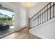 Entryway features a staircase, a glass door with blinds, and access to the outdoor patio at 677 Stickley Oak Way, Woodstock, GA 30189