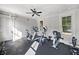 Bright home gym is equipped with treadmill, elliptical, and stationary bike at 677 Stickley Oak Way, Woodstock, GA 30189