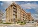 A stylish brick apartment building with retail shops on the ground floor at 677 Stickley Oak Way, Woodstock, GA 30189