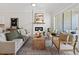 Bright living room with a fireplace, wooden floors, and sliding glass doors at 677 Stickley Oak Way, Woodstock, GA 30189