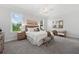 Spacious main bedroom features lots of natural light and ceiling fan at 677 Stickley Oak Way, Woodstock, GA 30189