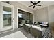 Relaxing outdoor patio with ceiling fan and comfortable seating arrangement at 677 Stickley Oak Way, Woodstock, GA 30189