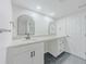Bathroom vanity with double mirrors and granite countertop at 6851 Roswell Rd # 0-26, Atlanta, GA 30328