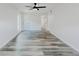 Spacious bedroom featuring new floors, a ceiling fan, and ample natural light at 6851 Roswell Rd # O-26, Atlanta, GA 30328
