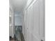 Hallway with closet space and wood-look flooring at 6851 Roswell Rd # O-26, Atlanta, GA 30328