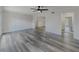 Spacious living room with sleek gray hardwood flooring and neutral paint at 6851 Roswell Rd # O-26, Atlanta, GA 30328