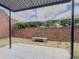 Enclosed patio featuring stone bench, tiled floor, and a full brick wall for privacy at 6851 Roswell Rd # O-26, Atlanta, GA 30328