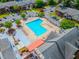 Aerial view of a community pool with lounge chairs and surrounding lush landscape at 6851 Roswell Rd # O-26, Atlanta, GA 30328