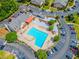 Aerial view of a community pool surrounded by parking and trees at 6851 Roswell Rd # O-26, Atlanta, GA 30328