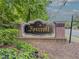 Attractive Foxcroft Condominium signage with brick surround and lush landscaping at 6851 Roswell Rd # O-26, Atlanta, GA 30328