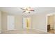 Bedroom featuring neutral walls, carpet flooring, and two entryways at 1647 Shire Village Dr, Sugar Hill, GA 30518