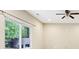 Bedroom with a ceiling fan and a large window that lets in natural light at 1647 Shire Village Dr, Sugar Hill, GA 30518