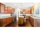 Kitchen with granite countertops, stainless steel appliances, central island, and pantry at 1647 Shire Village Dr, Sugar Hill, GA 30518