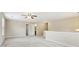 Spacious living room with neutral walls, carpet flooring, and ceiling fan at 1647 Shire Village Dr, Sugar Hill, GA 30518