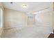 Spacious carpeted living room offering ample natural light from the large windows at 1647 Shire Village Dr, Sugar Hill, GA 30518