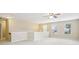 Spacious loft area with neutral walls, carpet flooring, ceiling fan and natural light from multiple windows at 1647 Shire Village Dr, Sugar Hill, GA 30518