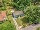Aerial view of a charming home with a well-manicured lawn, mature trees, and a welcoming curb appeal at 1798 S Gordon Sw St, Atlanta, GA 30310