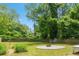 Backyard with mature trees, a defined circular fire pit area and plenty of space to spread out at 1798 S Gordon Sw St, Atlanta, GA 30310