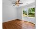 Bright bedroom features hardwood floors, two large windows, and natural light at 1798 S Gordon Sw St, Atlanta, GA 30310
