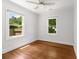 Bedroom featuring hardwood floors, two windows that let in natural light, and neutral paint at 1798 S Gordon Sw St, Atlanta, GA 30310