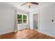 Bedroom features hardwood floors, natural light, and an ensuite bathroom at 1798 S Gordon Sw St, Atlanta, GA 30310