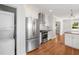 Kitchen includes stainless steel appliances, white cabinets, and adjacent washer/dryer at 1798 S Gordon Sw St, Atlanta, GA 30310