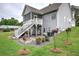Backyard featuring a screened-in porch, a patio area, and landscaped garden beds with irrigation at 18 Spring Lake Ne Trl, White, GA 30184