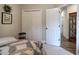 Comfortable bedroom with a view to the hallway and closet with bi-fold doors at 18 Spring Lake Ne Trl, White, GA 30184