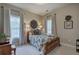 Cozy bedroom with two windows providing natural light and charming décor at 18 Spring Lake Ne Trl, White, GA 30184
