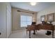 Versatile bonus room with a piano, closet, and window with blinds at 18 Spring Lake Ne Trl, White, GA 30184