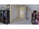 Bonus room with neutral carpet, showing versatile storage solutions with built-in bookshelves and closet space at 18 Spring Lake Ne Trl, White, GA 30184