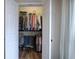 Open closet with hanging rods and shelving, providing organized storage solutions at 18 Spring Lake Ne Trl, White, GA 30184