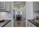 Formal dining room view from kitchen, features chandelier and large windows at 18 Spring Lake Ne Trl, White, GA 30184