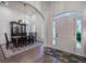 Inviting entryway with high ceilings, hardwood floors, and elegant dining area adjacent to the foyer at 18 Spring Lake Ne Trl, White, GA 30184