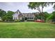 Charming home with manicured lawn, stone accents, and inviting front porch at 18 Spring Lake Ne Trl, White, GA 30184