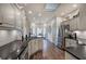 Spacious kitchen featuring stainless steel appliances, dark countertops, and a dining area at 18 Spring Lake Ne Trl, White, GA 30184