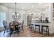 Eat-in kitchen featuring stainless steel appliances, hardwood floors, and casual dining space at 18 Spring Lake Ne Trl, White, GA 30184