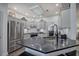 Modern kitchen equipped with stainless steel appliances, granite countertops, and bright lighting at 18 Spring Lake Ne Trl, White, GA 30184