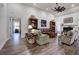 Spacious living room with a fireplace, vaulted ceilings, hardwood floors, and cozy seating area at 18 Spring Lake Ne Trl, White, GA 30184