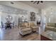 Open-concept living room with hardwood floors, seamlessly connecting the dining area and kitchen at 18 Spring Lake Ne Trl, White, GA 30184